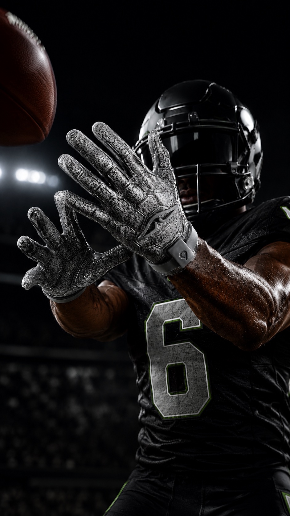 Football receiver catching in ARMA smoke-gray gloves